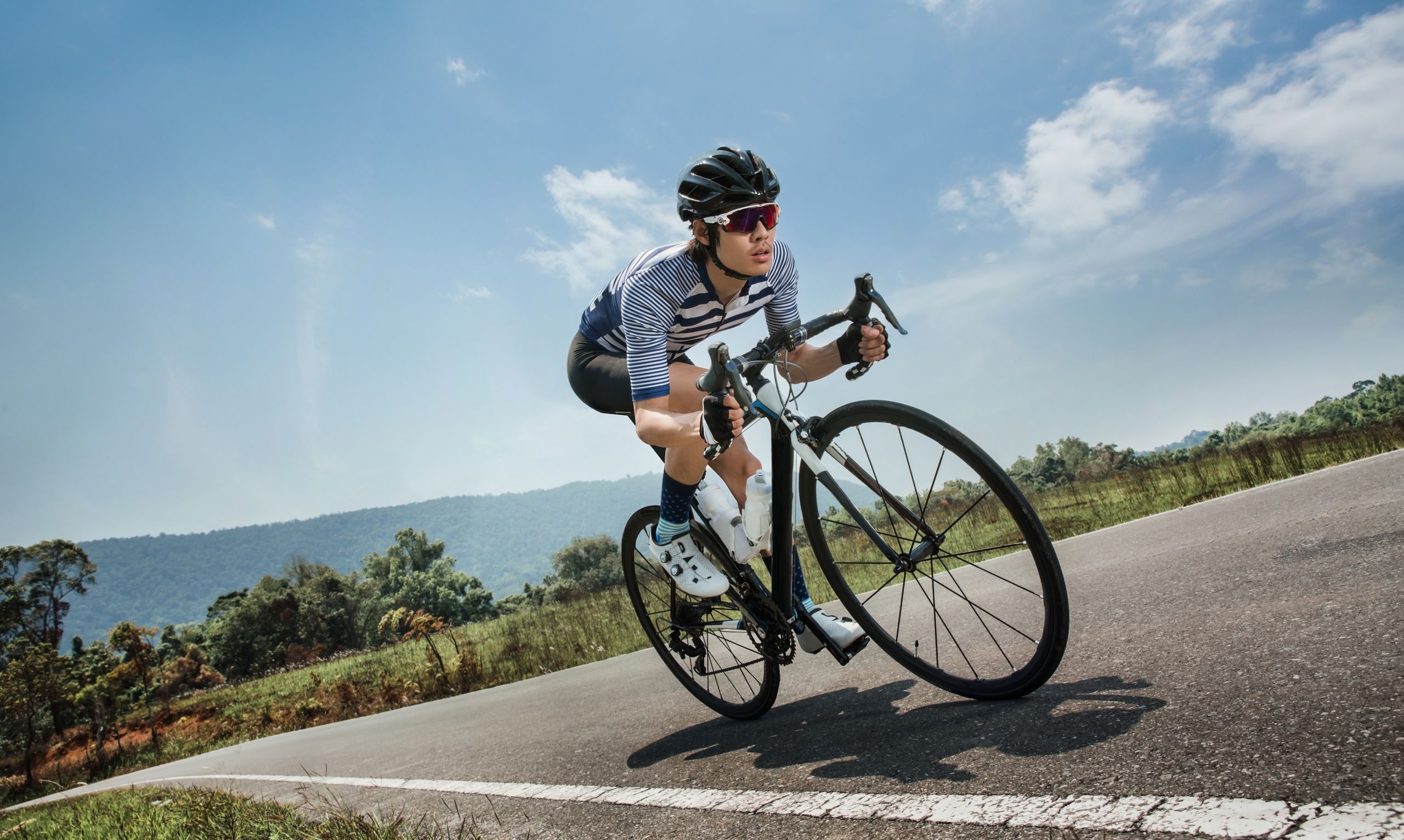 Asian men are cycling road bike in the morning