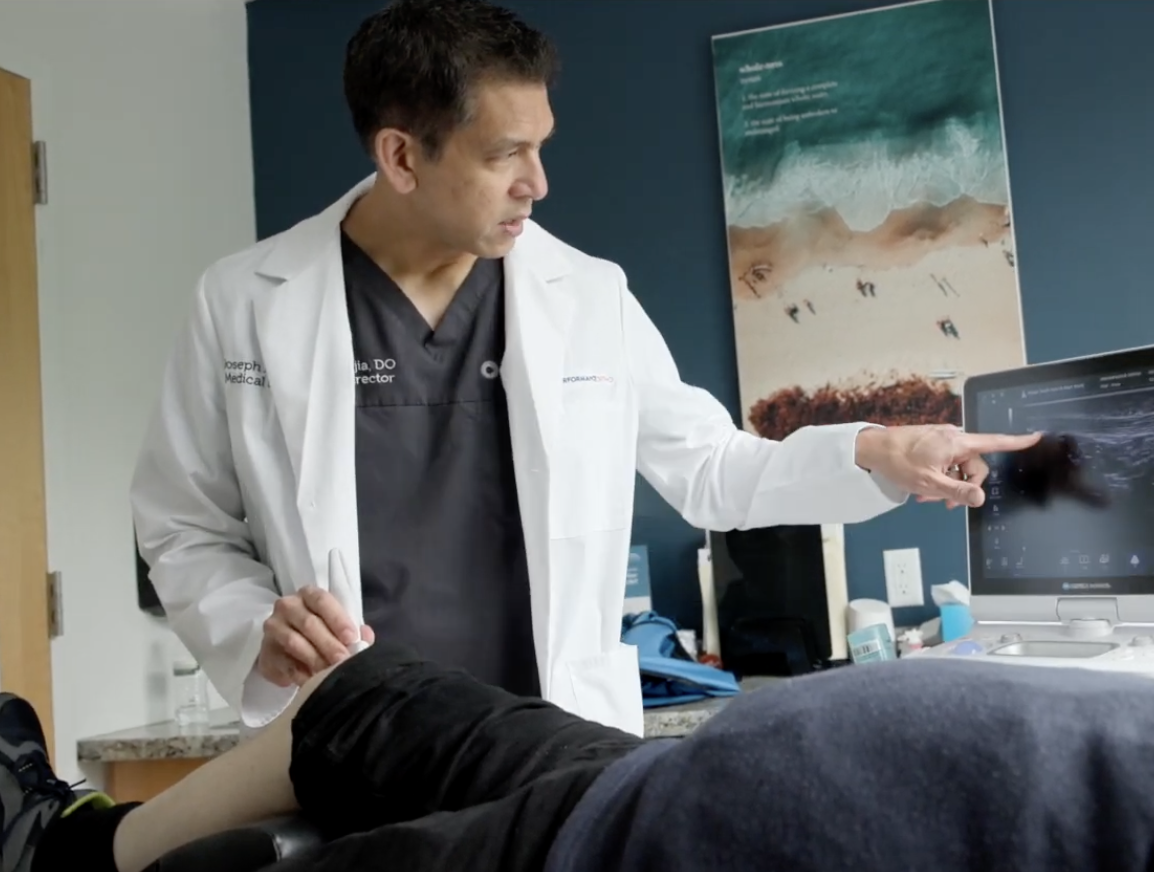dr-mejia-diagnostic-testing Dr Mejia performing diagnostic testing on a patient's knee