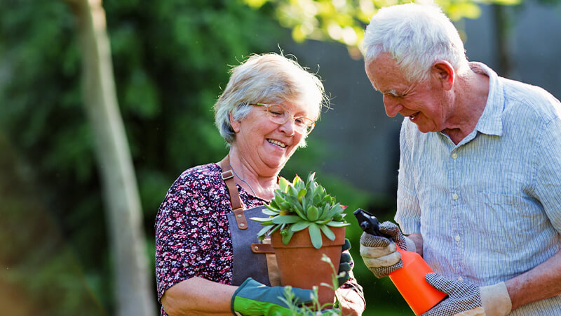 joint-preservation-testimonial-ruth Joint preservation program testimonial. Woman smiling while gardening.